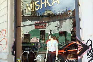 10 Graffiti Street Art Reflected In The Window Of Mishka On Balcarce San Telmo Buenos Aires
